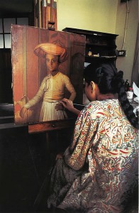 Shanti Majee-De cleaning "Portrait of Shukur Ullah" by Thomas Hickey 1796